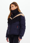 THE UPSIDE women’s navy Hakuba Fox Puffer Jacket is a true-to-size fit, featuring a water-resistant coating, fringed detailing, fleece-lined zip pockets and an adjustable elastic at hem. Designed for Après-ski and winter wear.