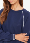 THE UPSIDE women’s navy organic cotton Astra Paloma Crew offers an oversized fit and features an embroidered horseshoe logo on front in navy. Made for lifestyle.