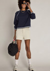 THE UPSIDE women’s navy organic cotton Astra Paloma Crew offers an oversized fit and features an embroidered horseshoe logo on front in navy. Made for lifestyle.
