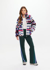 THE UPSIDE women’s Harlow Fleece Zip Through in multi star design features a relaxed fit, contrast woven binds, and a zip chest pocket. Made for everyday wear.