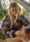 THE UPSIDE women’s organic cotton Mirage Carmen Quilted Jacket is an oversized fit and features a zip opening and pockets in our navy and tan geometric print. Made for lifestyle.