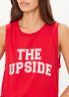 THE UPSIDE women's red organic cotton Jeet Tank Top has a relaxed fit with folded armhole detail and cream varsity logo at chest. Made for everyday wear.