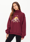 THE UPSIDE women’s maroon organic cotton Le Ski Clementine Crew is designed for an oversized fit and features Le Ski logo print & embroidery on front chest. Designed for Après-ski and winter wear.