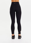 THE UPSIDE women’s black recycled peached Celestia 25inch Legging is a soft & supportive fit and features a drawcord and printed star and horseshoe on ankles. Made for yoga & pilates.