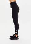 THE UPSIDE women’s black recycled peached Celestia 25inch Legging is a soft & supportive fit and features a drawcord and printed star and horseshoe on ankles. Made for yoga & pilates.