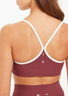 THE UPSIDE women’s red recycled peached Samara Bowie Bra offers a soft & supportive fit and features a scooped front neckline with crossback and removable cups. Made for yoga & pilates.