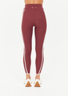 THE UPSIDE women’s red recycled peached Samara 25inch Legging is a soft & supportive fit and features side pockets and contrast cream stripes with curved hem detail. Made for pilates.
