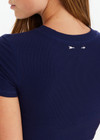 THE UPSIDE women’s navy Shelter Fitted Tee features an embroidered arrow logo at the back of neck. The perfect everyday tee.