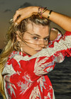 THE UPSIDE women's red Palma Bobbi Collared Shirt features sleeve plackets, pearlised buttons, and cream crochet lace panels. Perfect for travel or lifestyle.