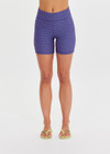 THE UPSIDE women's blue check Aliki 5inch Spin Short offers a firm, supportive fit with mid-rise in a recycled textured fabric. Made for yoga and pilates.