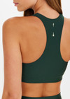 THE UPSIDE women’s green Maneki Jetta Racerback Bra features a V-neck in recycled fabric, removable cups, and elastic underbust support. Made for yoga and pilates.