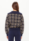 THE UPSIDE women’s navy organic cotton Cosmo Kairo Half Zip Knit is a relaxed fit and features a half zip front and beige knitted stripes down sleeves. Made for everyday leisure.