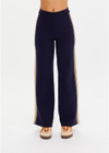 THE UPSIDE women’s navy organic cotton Cosmo Freya Knit Pant is a true-to-size fit and features an elasticated waistband with beige knitted side stripes. Made for everyday wear.
