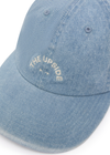 THE UPSIDE women's blue cotton Washed Denim Soft Cap offers a soft, retro fit with an embroidered cream horseshoe logo and an adjustable back strap. Made for everyday wear.
