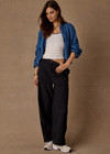 THE UPSIDE women’s black recycled fabric Estelle Barrel Pant is designed for a boxy fit and features a structured waistband with belt loops and side seam pockets. Made for everyday.