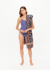 THE UPSIDE women's navy and tan cotton Ezra Beach Towel features a two-tone jacquard monogram design with knotted tassels at each end. Made for swim.