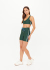 THE UPSIDE women’s green eco tech Maneki 5In Spin Short offers a supportive, comfortable fit with elastic drawcord waist and quick-dry breathable fabric. Made for lifestyle.