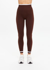 THE UPSIDE women's brown Form Seamless 25in Midi Pant is designed for a firm & supportive fit and features contrast white stripes on waist and ankles. Made for yoga & pilates.