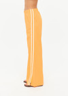 THE UPSIDE women’s lightweight yellow Juliet Pant features a low-rise fit with contrast binds and split hem detail. Perfect for travel and everyday wear.