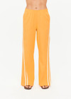 THE UPSIDE women’s lightweight yellow Juliet Pant features a low-rise fit with contrast binds and split hem detail. Perfect for travel and everyday wear.