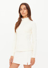 THE UPSIDE women's cream Courtship Dova Run Top is a form fitting long-sleeve and features a quarter zip opening with mock neck, thumb holes and invisible zip pockets. Made for running.