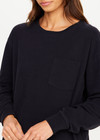 THE UPSIDE women's black recycled cotton Soho Cara Long Sleeve Top is designed for a relaxed fit and features a ribbed neck and cuffs and a patch pocket at front. Made for everyday leisure.