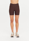 THE UPSIDE women's brown Peached 5inch Spin Short offers a soft & supportive fit in recycled peached fabric and features a printed arrow logo on back waistband. Made for pilates & yoga.
