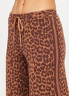 THE UPSIDE women's leopard organic cotton Malawi Freya Knit Pant is true-to-size and features a elasticated waistband with drawcord and short splits at hem. Made for everyday.