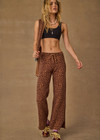 THE UPSIDE women's leopard organic cotton Malawi Freya Knit Pant is true-to-size and features a elasticated waistband with drawcord and short splits at hem. Made for everyday.