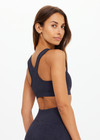 THE UPSIDE women's black Seamless Jade Racerback Bra offers a soft & comfortable fit and features removable cups in a rib fabrication. Made for yoga & pilates.