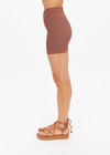 THE UPSIDE women's orange & navy check Solaris 5inch Spin Short is mid-rise and features an embroidered arrow logo at back. Made for yoga & pilates.