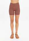 THE UPSIDE women's orange & navy check Solaris 5inch Spin Short is mid-rise and features an embroidered arrow logo at back. Made for yoga & pilates.