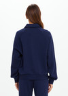 THE UPSIDE women's navy organic cotton Collared Elle Polo is a relaxed long sleeve polo featuring buttons on front. Made for everyday.