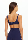THE UPSIDE women's navy recycled peached Maison Rory Scoop Bra features a scooped square neckline and removable cups. Made for yoga & pilates.
