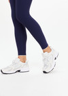 THE UPSIDE women's navy recycled peached Maison 25inch Midi Pant is mid-rise and features cream scalloped edge trim at hem. Made for yoga & pilates.