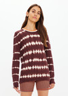 THE UPSIDE women's brown & cream tie dye organic cotton Amana Long Sleeve Knit is designed for a relaxed fit and features a contrast striped neckline in orange. Made for everyday.