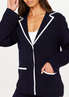 THE UPSIDE women's navy Monte Carlo Alix Knit Blazer fits true-to-size and features contrast white edge along collar and placket and patch pockets at front. Made for lifestyle.