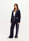 THE UPSIDE women's navy Monte Carlo Alix Knit Blazer fits true-to-size and features contrast white edge along collar and placket and patch pockets at front. Made for lifestyle.