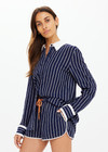 THE UPSIDE women's navy & white stripe Belize Bobbi Collared Shirt features a ruffled detail and sleeve cuff with button closure in linen fabrication. Made for lifestyle.