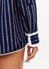 THE UPSIDE women's navy & white stripe Belize Bobbi Collared Shirt features a ruffled detail and sleeve cuff with button closure in linen fabrication. Made for lifestyle.