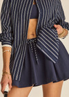 THE UPSIDE women's navy tennis, pickleball & padel Daria Skort is made from organic cotton and features an internal short with elasticated waistband and drawcord.