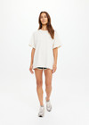 THE UPSIDE women's cream organic cotton Molokai Sammi Tee offers a oversized fit and features a green printed palm logo on front chest and back. Made for lifestyle.