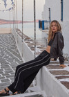 THE UPSIDE women's black Haveli Wide Leg Pant is true to size with a structured waistband, fly zipper, belt loops, and cream embroidered side seams. Made for lifestyle.