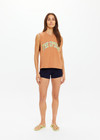 THE UPSIDE women's orange organic cotton Dawson Tank has a relaxed fit, mid length, and a printed lime varsity logo on the front chest. Made for lifestyle.