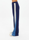 THE UPSIDE women's navy Lenzing viscose Petra Flare is designed for a true-to-size fit and features flare pants with splits and contrast chevron tape down side seams. Made for lifestyle.