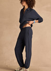 THE UPSIDE women's navy organic cotton Harrison Trackpant offers a relaxed fit and features an elasticated waistband with side pockets. Perfect for everyday comfort.