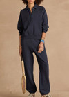 THE UPSIDE women's navy organic cotton Harrison Trackpant offers a relaxed fit and features an elasticated waistband with side pockets. Perfect for everyday comfort.