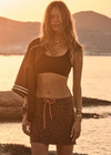 THE UPSIDE women's leopard organic cotton Malawi Karly Knit Mini Skirt offers a relaxed fit, featuring an elasticated waistband with orange drawcord and knitted stripes down sides. Made for lifestyle.