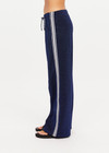 THE UPSIDE women's navy Galaxia Loretta Pant is designed for a mid to low rise fit and features elasticated waistband, drawcord with side seam pockets and knitted tape down sides. Made for lifestyle.