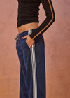 THE UPSIDE women's navy Galaxia Loretta Pant is designed for a mid to low rise fit and features elasticated waistband, drawcord with side seam pockets and knitted tape down sides. Made for lifestyle.